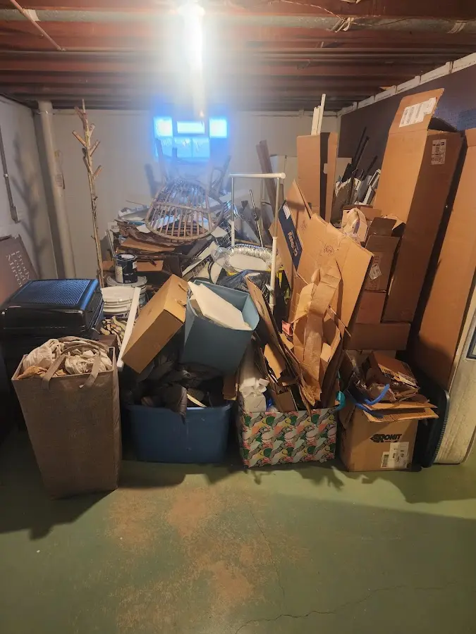 Roll-off dumpster container at job site for 15 Yard Dumpster Rental in Clinton